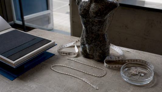 Mannequin bust with measuring tape and silver chain