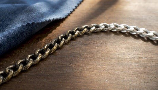 Close-up of silver chain showing tarnish and patina