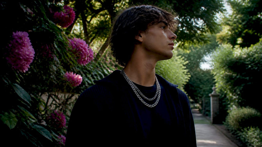 Teen wearing layered silver chains close-up
