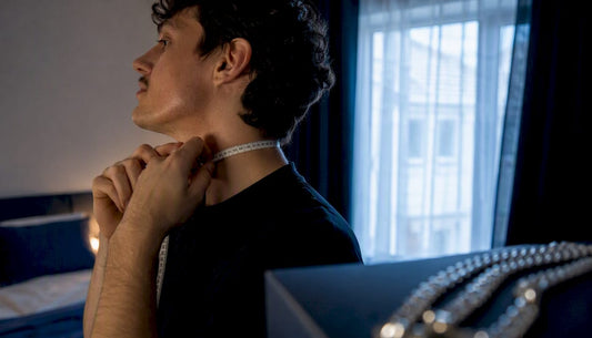 Person measuring neck for chain length