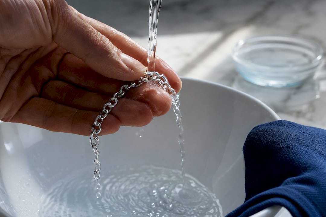 Sterling silver chain rinsed under water