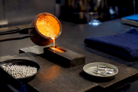 Recycled silver being refined in workshop