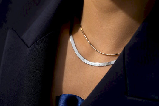 Herringbone and snake chains styled at neckline