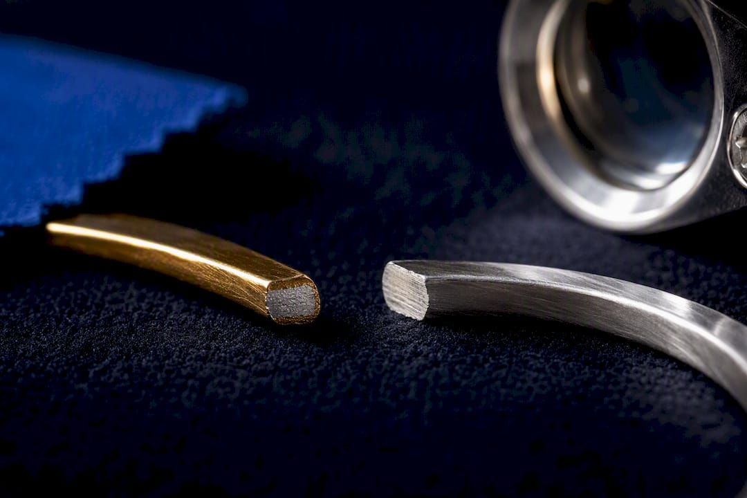 Gold coating over silver beside solid sterling silver