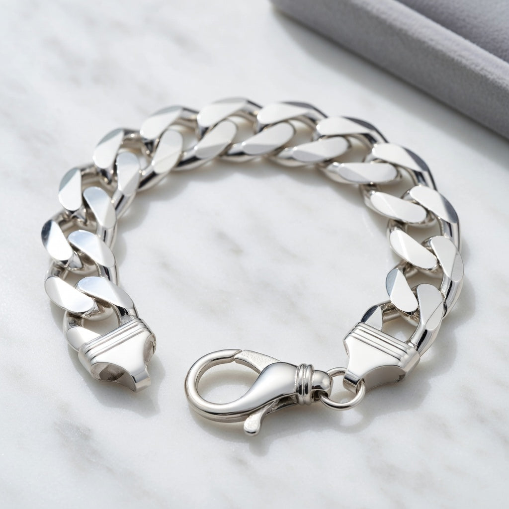Silver chain bracelet on a light gray background