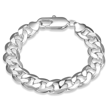 Thick silver chain bracelet on a white bakgrounds