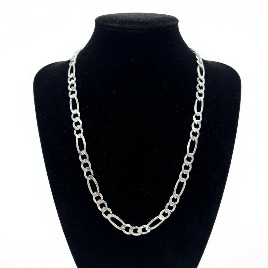 Silver figaro chain necklace on a black mannequin bust