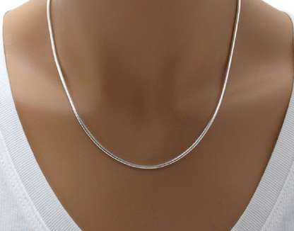 Woman wearing 2mm sterling silver 925 snake chain necklace 18 inch polished diamond cut hypoallergenic jewelry


