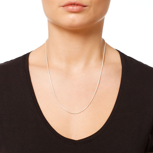 Close-up of woman modeling 2mm sterling silver snake chain necklace 18 inch shiny diamond cut

